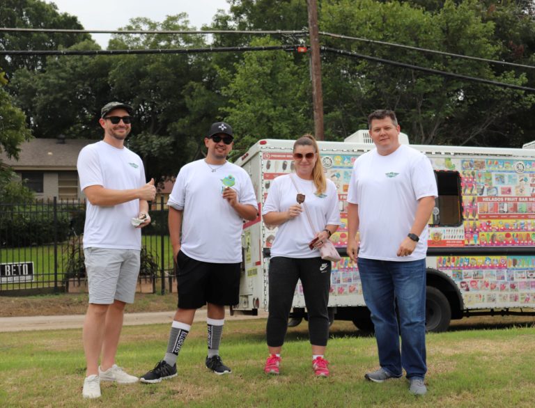 A group of team members enjoying ice cream from the ice cream truck at team member appreciation week field day.