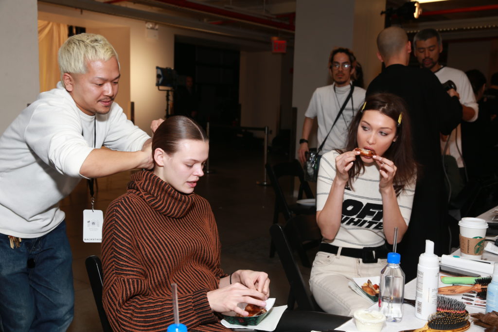 Celebrity models eat Wingstop backstage of Brandon Maxwell's NYFW
